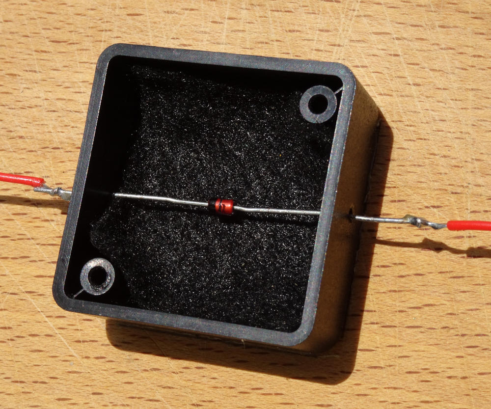 The Zener diode at the heart of our quantum entropy generator on a wooden breadboard.